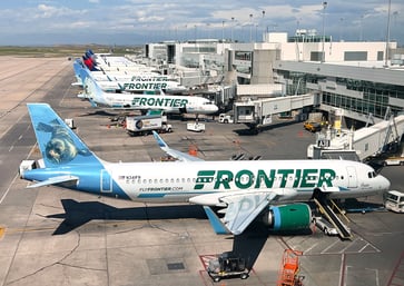 Industry battles for high-paying flyers as Frontier Airlines installs first-class seats.