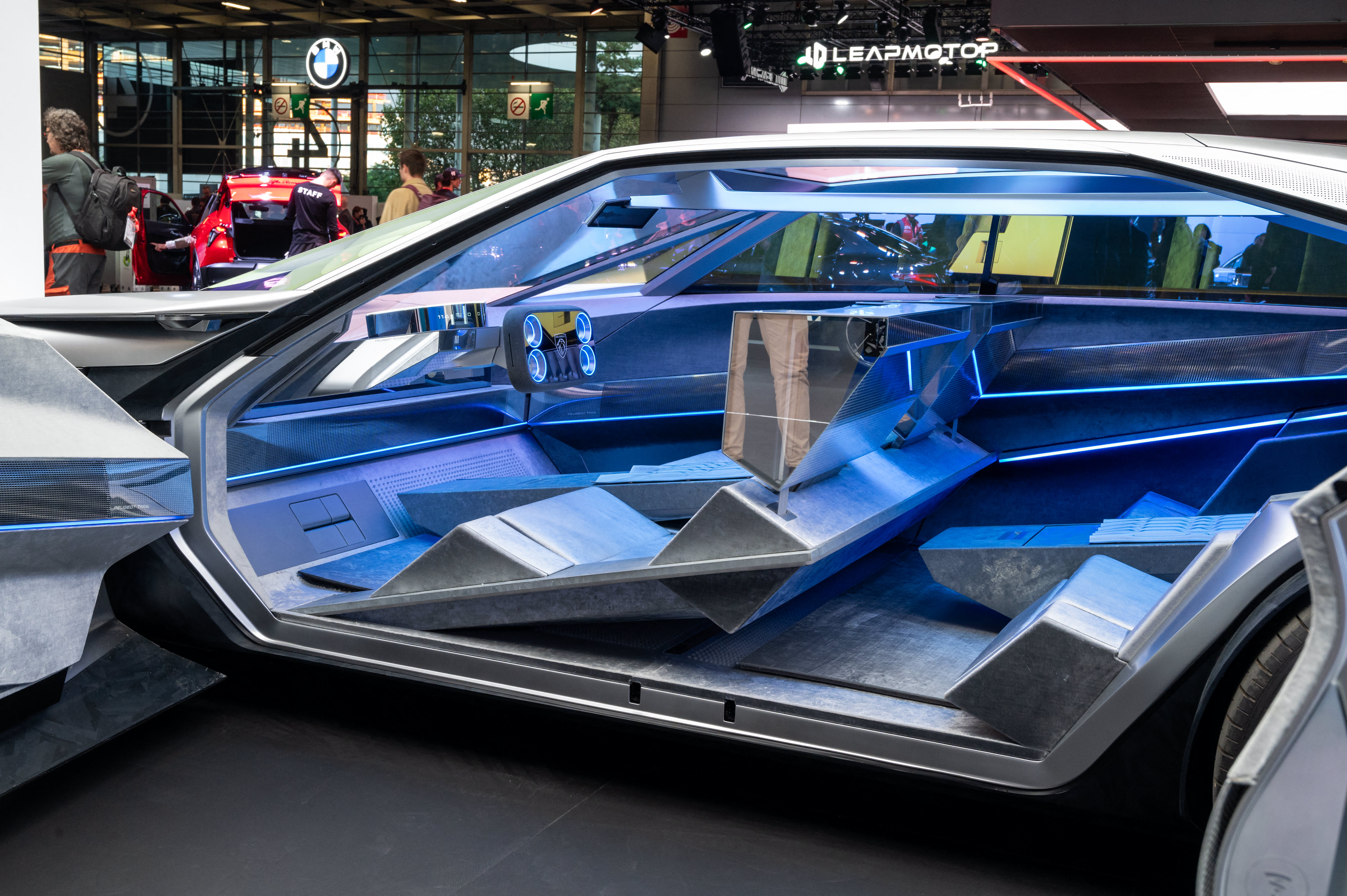 The Paris auto show features swimming cars and rectangular steering wheels.