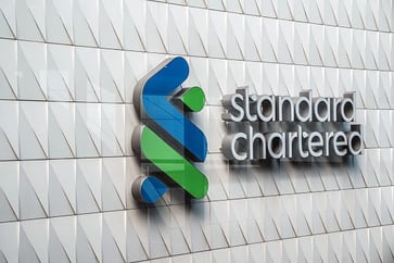 Standard Chartered raises income guidance after exceeding third-quarter profit expectations.