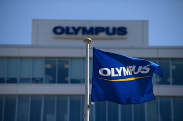 After CEO resigns over drug allegation, Olympus shares plummet by more than 5%.