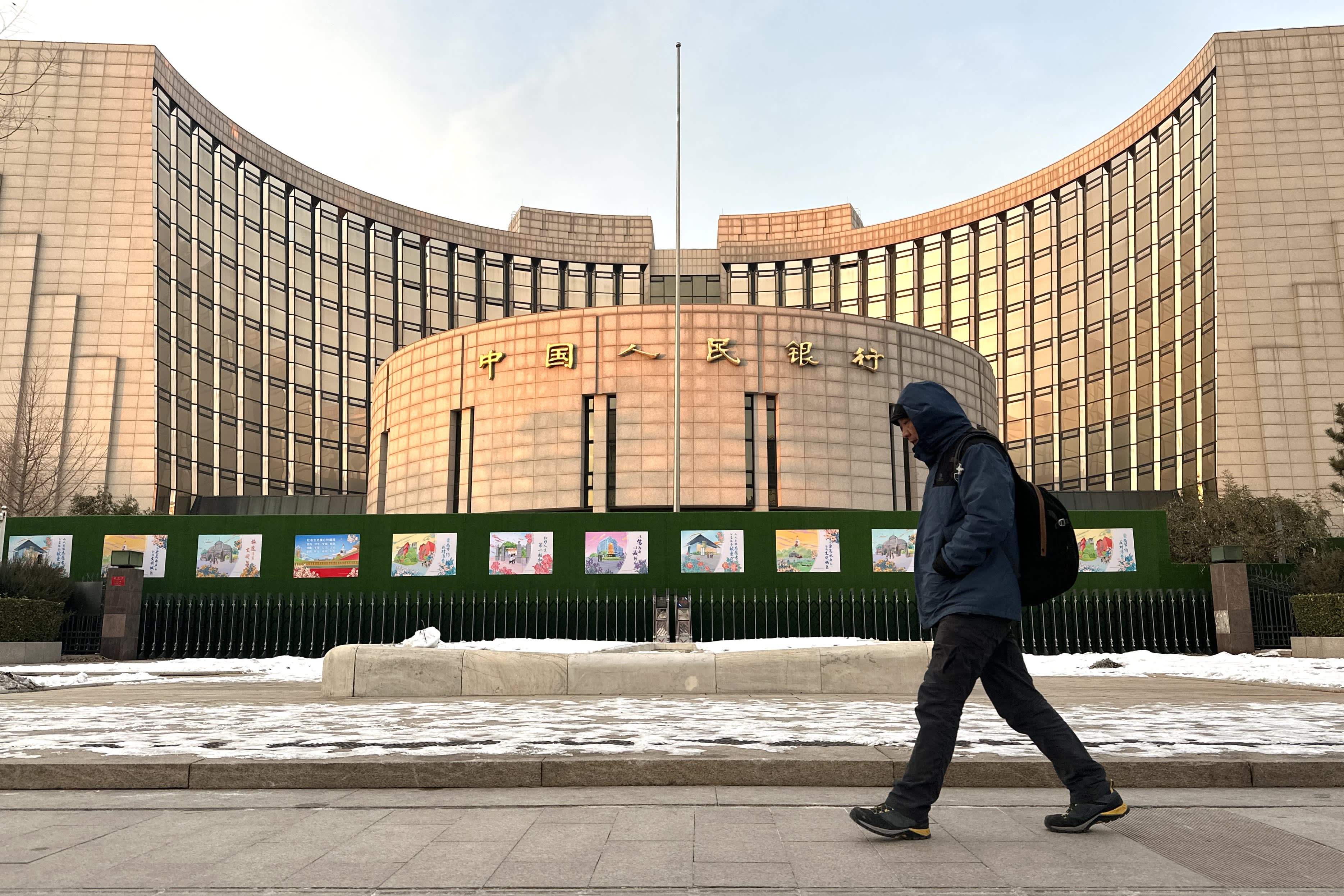 The Federal Reserve casts a shadow over China's central bank as it keeps key policy rate unchanged.