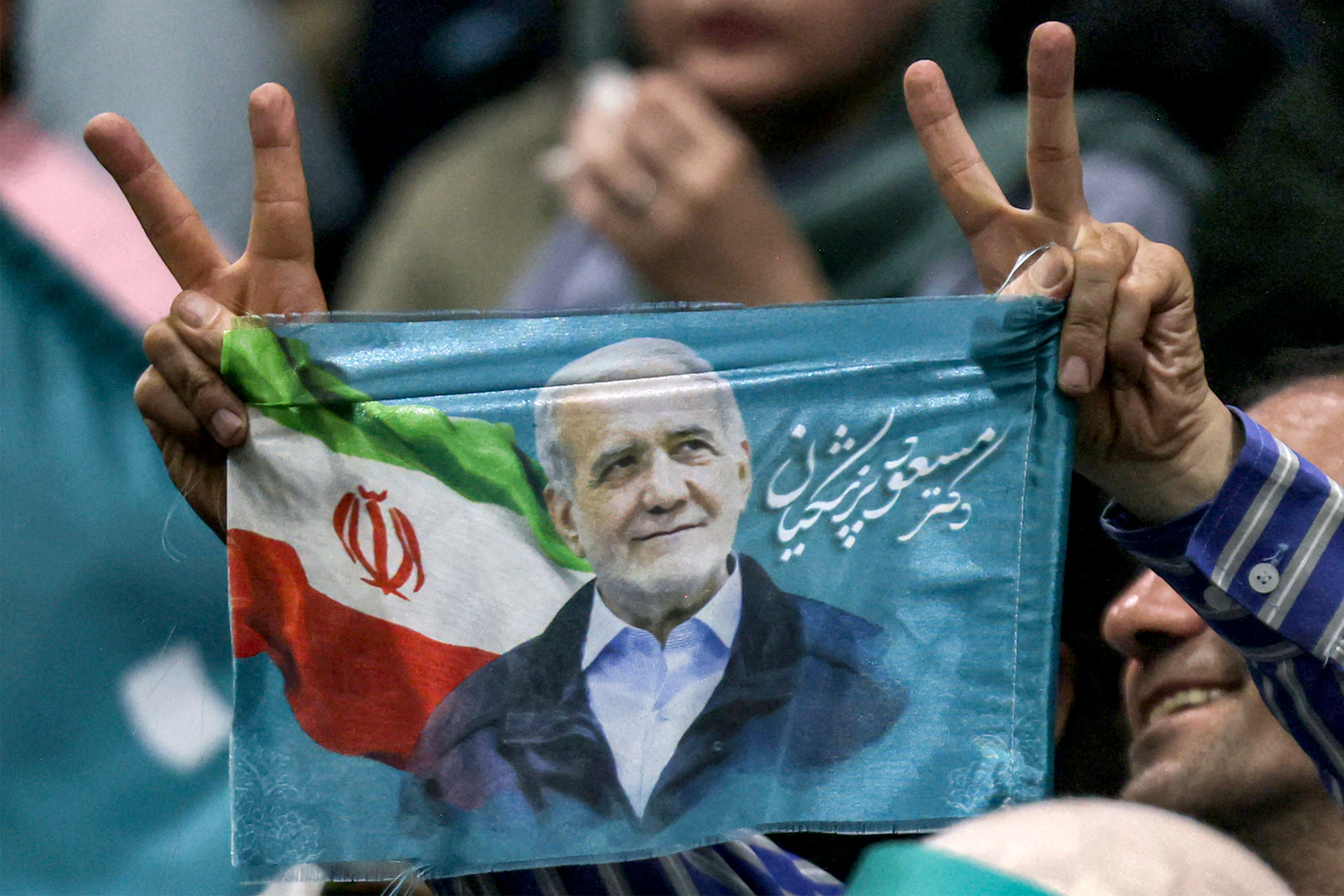 A runoff election is held in Iran between reformist and ultra-conservative presidential candidates, with a record low voter turnout.