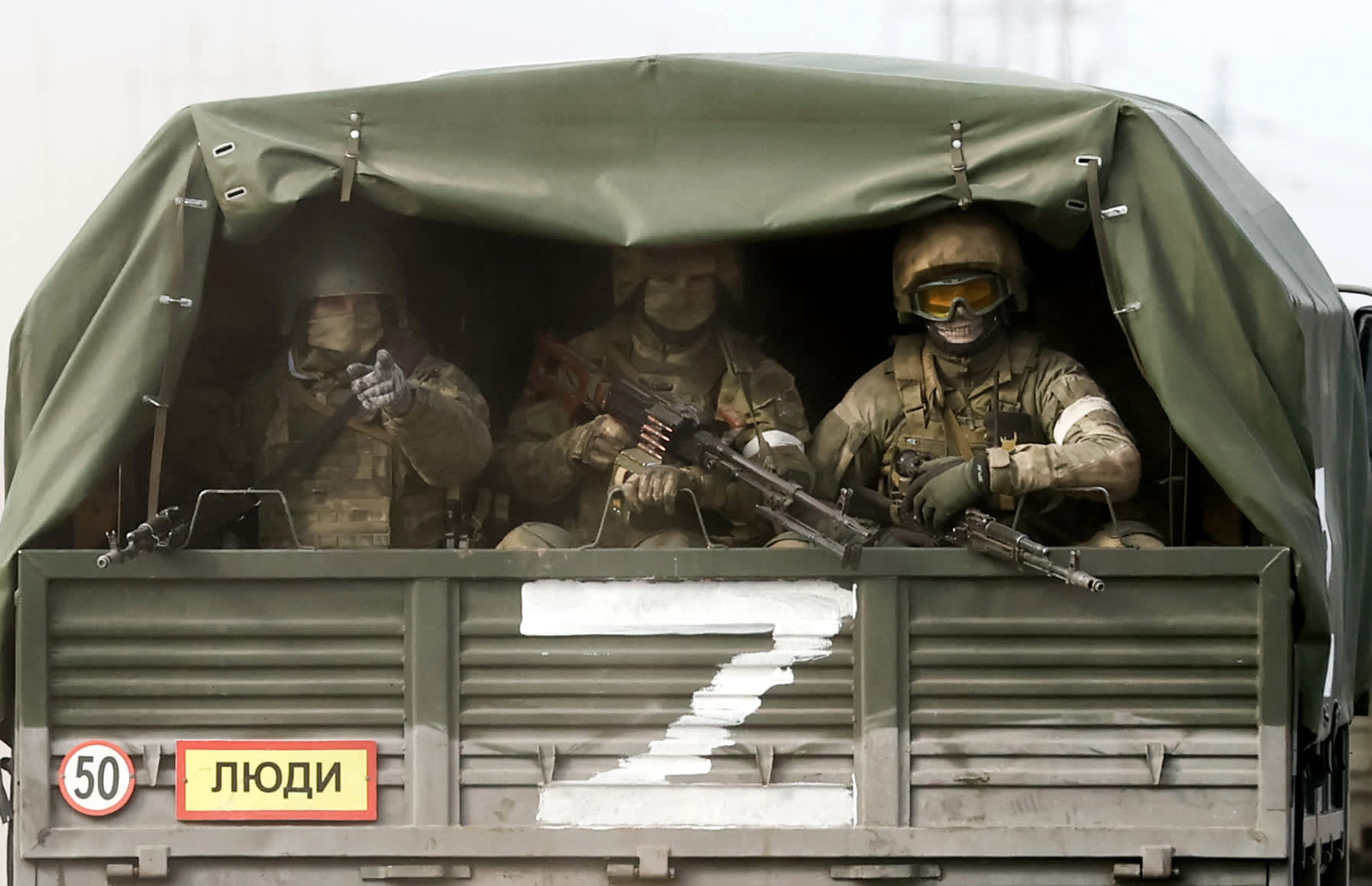 Russia's invasion of Ukraine is depicted in photographs.
