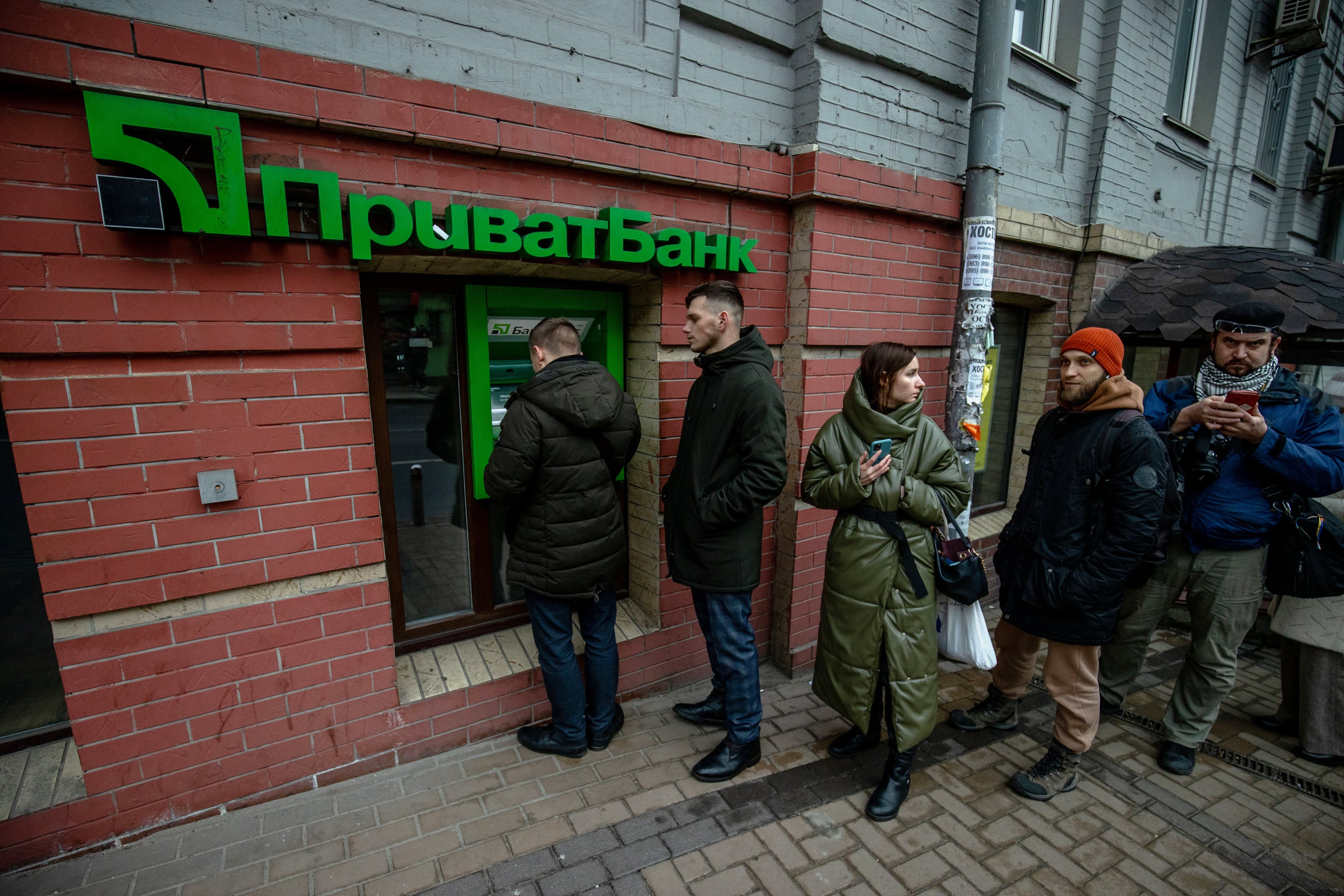The Russian economy is severely impacted by economic sanctions, causing the ruble to plummet and interest rates to rise.