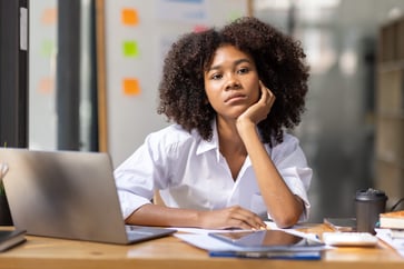 Four indications that your emotional investment at work is negatively impacting you, according to an executive coach.