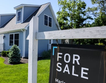 A buyer's market is indicated by the decrease in June home sales and the increase in supply.