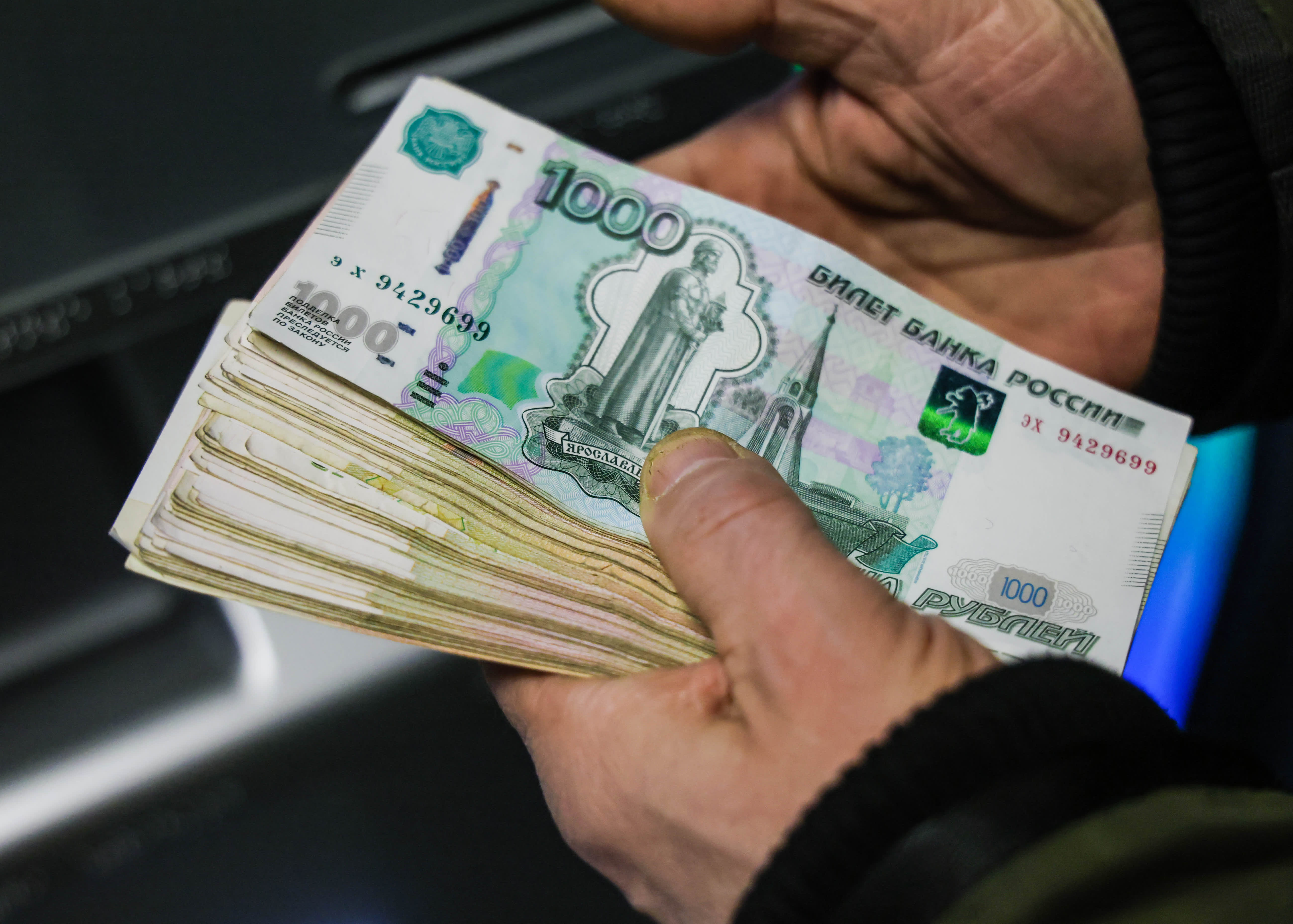 The ruble experiences a significant decline of approximately 30% in value against the dollar due to economic sanctions imposed because of the Ukraine invasion.
