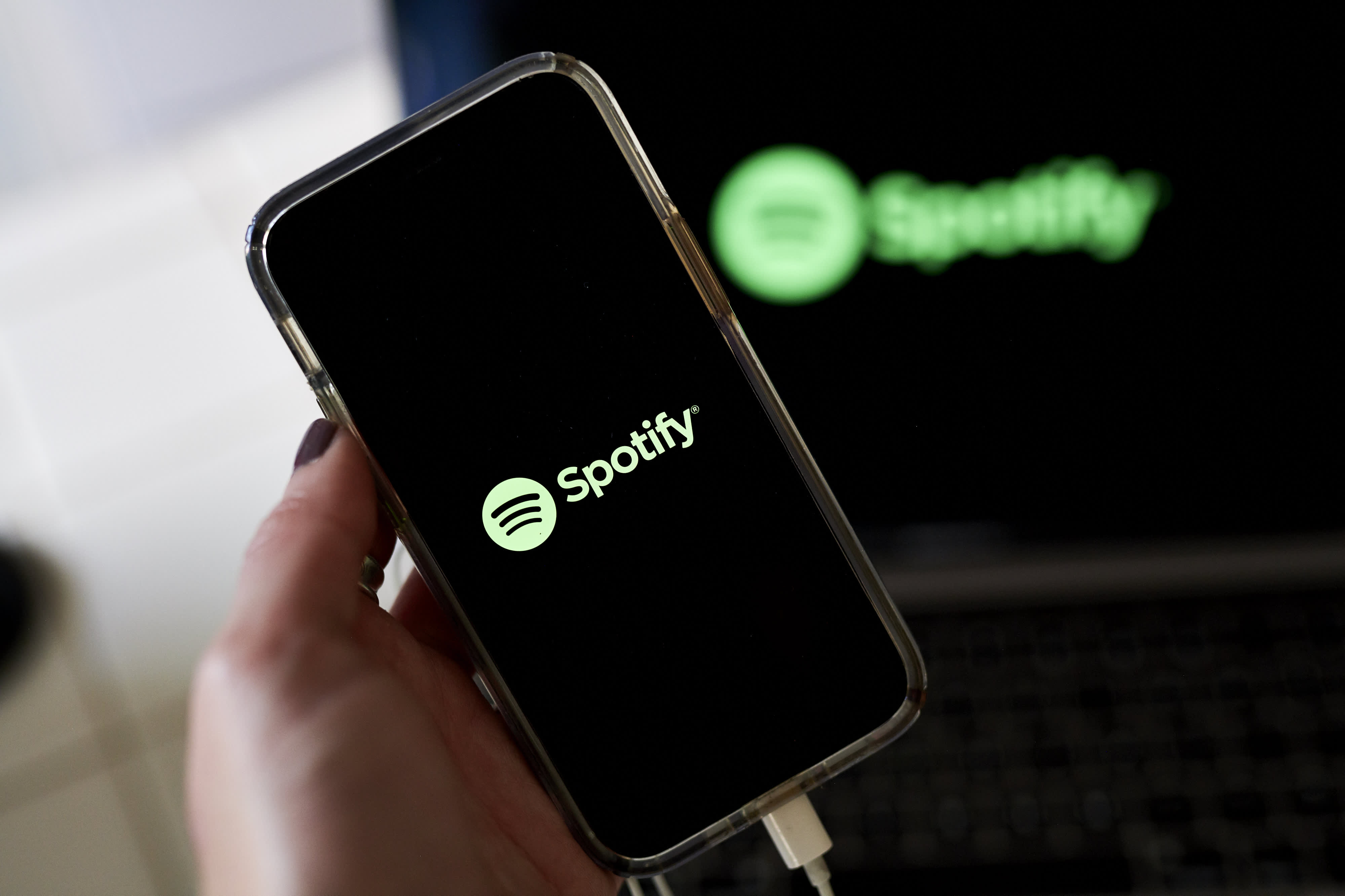 Spotify's stock price drops due to lackluster user growth forecasts.