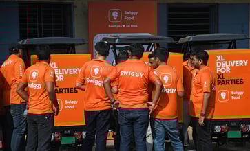 Swiggy's shares surge over 9% on India market debut following a successful IPO, backed by SoftBank.