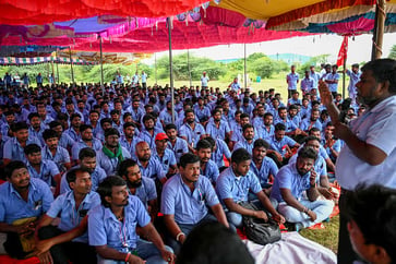 Workers' strike at Samsung India plant persists, causing shares to decline.