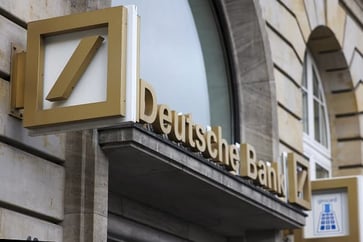 In the third quarter, Deutsche Bank reports a profit, surpassing expectations.