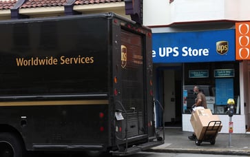 UPS stock declines following revenue forecast reduction.