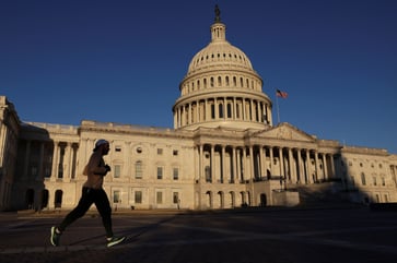 Biden signs legislation to avert government closure for three weeks.