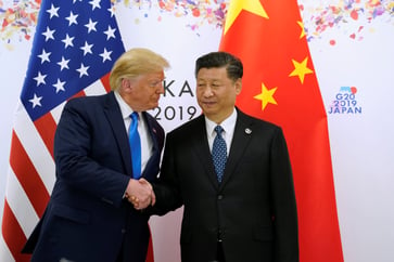 The U.S. is urged by China to cooperate as the threat of Trump's trade looms.