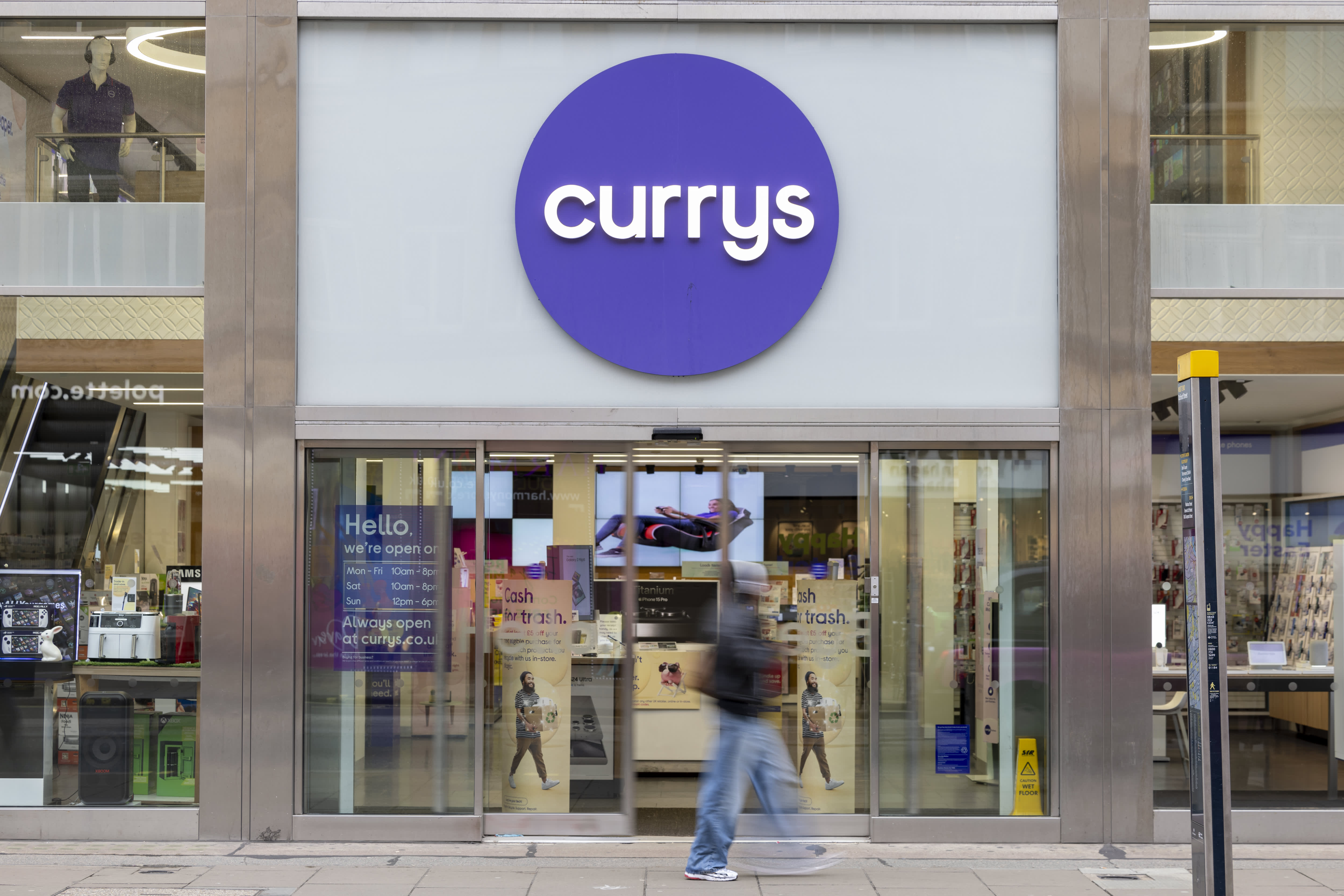 U.S. investment firm Elliott exits takeover race for British retailer Currys, resulting in a 10% drop in stock value.