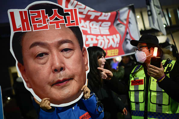 The former defense minister of South Korea attempted suicide, prompting police to raid the presidential office.