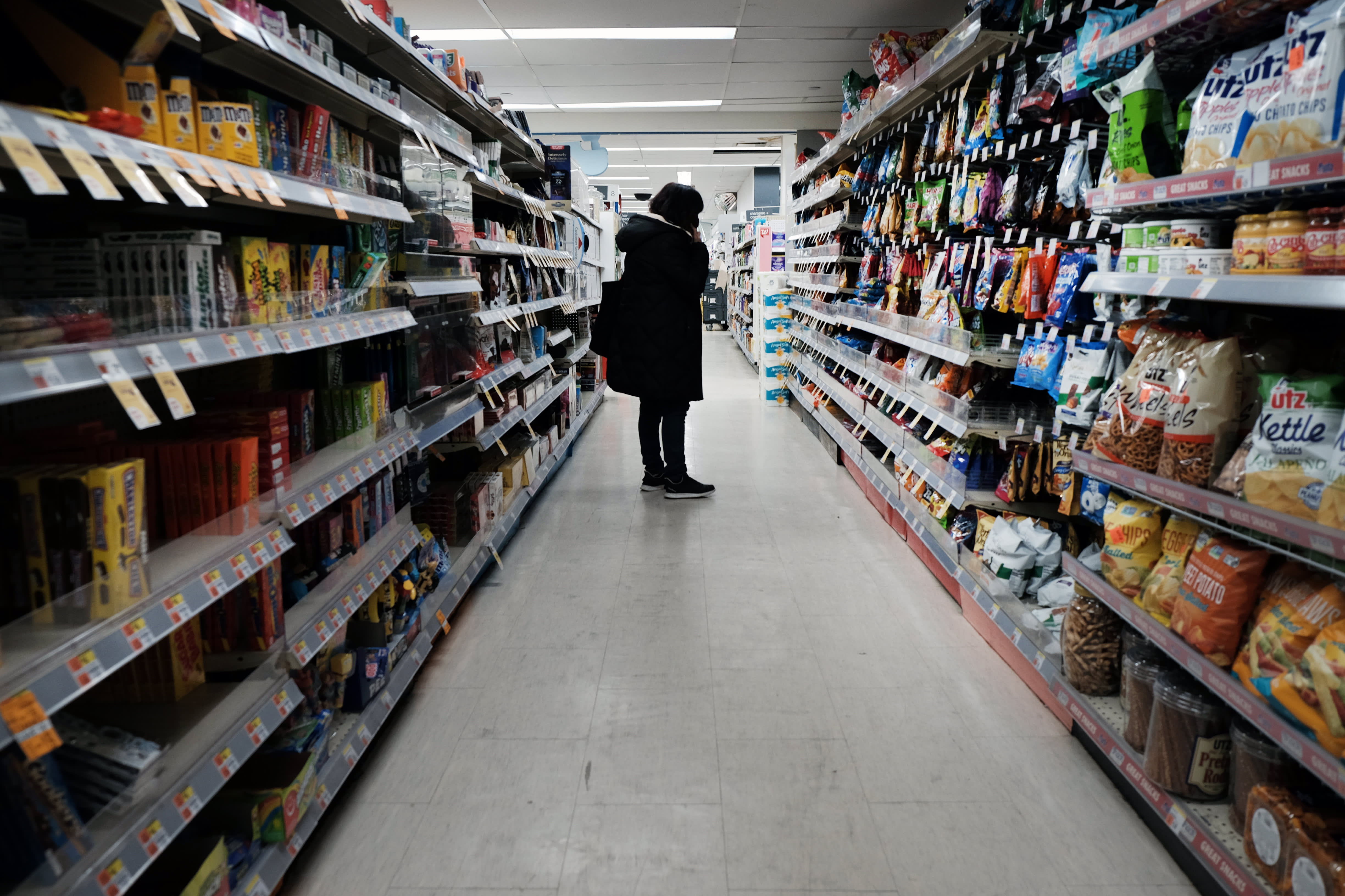 What is the purpose of the Federal Reserve raising interest rates to combat inflation?