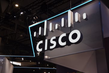 Cisco CEO cites cautious customers and inventory consumption issue for light forecast.