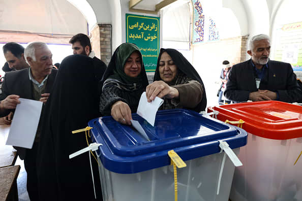 Amid economic strife, crackdowns and regional war, Iran holds presidential election.