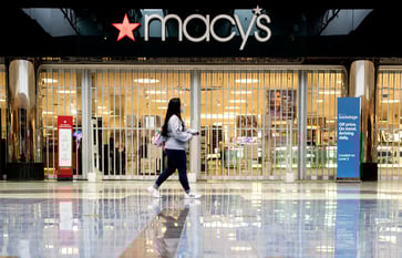 Consumers facing inflation may opt for travel spending instead of shopping, warns Macy's.