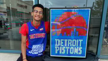 An 21-year-old college student earns $8,000 by creating mosaics of sports stars using cubes.