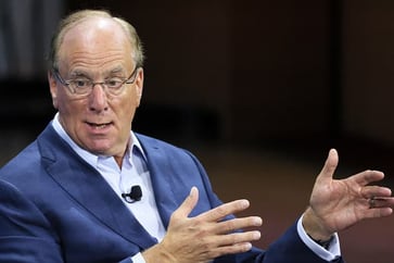 Larry Fink predicts that the Fed will not lower interest rates as much as markets anticipate in the upcoming year.