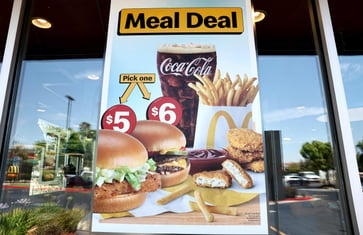 Summer value meals become a battleground for fast-food chains targeting low-income diners.