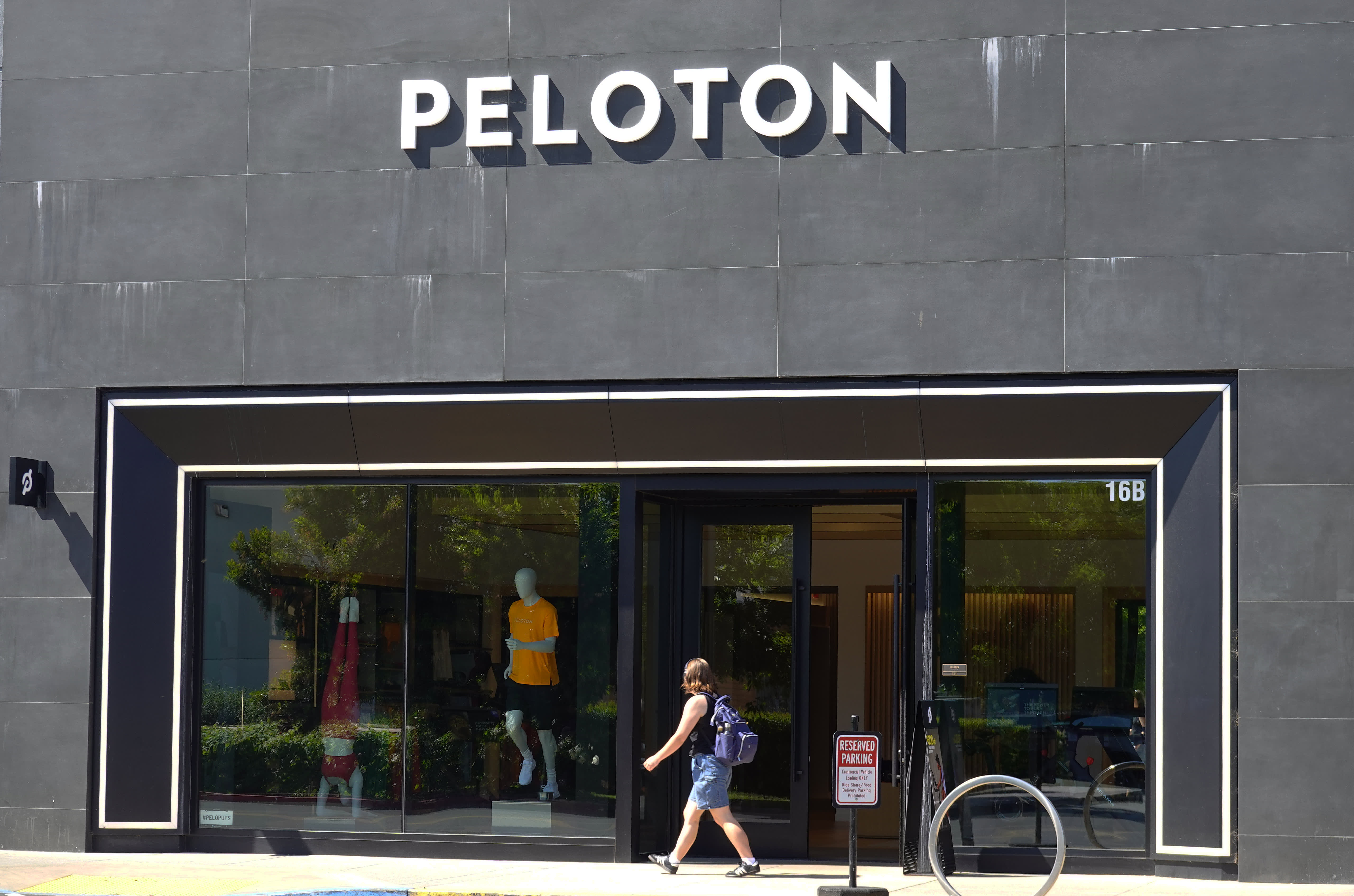 Peloton's stock price declines following announcement of refinancing to avoid financial strain.